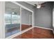 The cozy sunroom showcases wood flooring and large sliding doors to enjoy the outdoors at 914 Smokerise Blvd, Port Orange, FL 32127