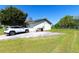 Exterior view of a home with a private driveway and fenced yard at 950 Windway Cir, Kissimmee, FL 34744