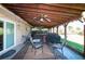 Covered patio area with a ceiling fan, outdoor seating, and a view of the backyard at 950 Windway Cir, Kissimmee, FL 34744