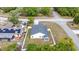 Aerial view of the property showcasing the fenced backyard, neighboring houses, and nearby street at 999 Trumbull St, Deltona, FL 32725