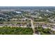 Residential neighborhood with tree-lined streets and well-maintained homes with a lake in the background at 999 Trumbull St, Deltona, FL 32725