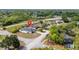 Charming single-story home with a white fence, surrounded by lush greenery in a quiet neighborhood at 999 Trumbull St, Deltona, FL 32725