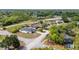 Charming single-story home with a white fence, surrounded by lush greenery in a quiet neighborhood at 999 Trumbull St, Deltona, FL 32725