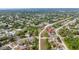 Residential neighborhood with tree-lined streets and well-maintained homes with a lake in the background at 999 Trumbull St, Deltona, FL 32725