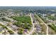 Aerial view of the property showcases its location within a quiet residential neighborhood near a greenway at 999 Trumbull St, Deltona, FL 32725