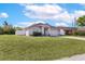 Charming home featuring a well-manicured lawn, two car garage, and neutral color palette at 999 Trumbull St, Deltona, FL 32725