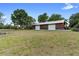 Spacious barn with metal roof and white garage doors in a scenic, open landscape at 1560 S Pearl St, Deland, FL 32720