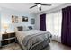Cozy bedroom featuring a plush bed, bright window, and modern lighting at 1560 S Pearl St, Deland, FL 32720
