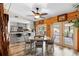 Dining area connects to kitchen, featuring wood paneling and an outdoor view at 1560 S Pearl St, Deland, FL 32720