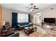 Living room featuring plush seating, stylish rug, and ample natural light at 1560 S Pearl St, Deland, FL 32720