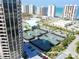 High-rise buildings overlook the tennis courts and beach, creating a luxurious scene at 1 Oceans West Blvd # 20B4, Daytona Beach, FL 32118