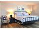 Bedroom with nautical decor, wood-look floors, and ample natural light at 1 Oceans West Blvd # 20B4, Daytona Beach, FL 32118