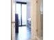 View of a bedroom with balcony and shower in the background at 1 Oceans West Blvd # 20B4, Daytona Beach, FL 32118