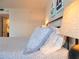 Bedroom with coastal decor and wood look flooring at 1 Oceans West Blvd # 20B4, Daytona Beach, FL 32118