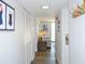 Long hallway with ample closet space and modern flooring extending to the living area at 1 Oceans West Blvd # 20B4, Daytona Beach, FL 32118