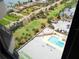 Relaxing pool area with lounge chairs and palm trees, offering a serene outdoor escape at 1 Oceans West Blvd # 20B4, Daytona Beach, FL 32118