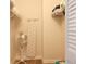 Organized storage room with shelving, ironing board, and fan at 1 Oceans West Blvd # 20B4, Daytona Beach, FL 32118