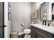 Cozy bathroom featuring a modern vanity, decorative artwork, and stylish fixtures at 1015 Tallacoe Trl, New Smyrna Beach, FL 32168
