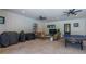 Entertainment space with casual seating, television, and a ping pong table for recreational enjoyment at 1015 Tallacoe Trl, New Smyrna Beach, FL 32168