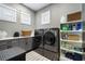 Well-organized laundry room with modern appliances, ample storage, and a functional design at 1015 Tallacoe Trl, New Smyrna Beach, FL 32168