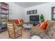 Comfortable lounge area featuring cozy sofas and an entertainment center, perfect for relaxation at 1015 Tallacoe Trl, New Smyrna Beach, FL 32168
