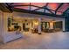 Expansive outdoor living area features a seating area, dining space, and recreational area at 1015 Tallacoe Trl, New Smyrna Beach, FL 32168