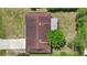 A top-down aerial view of a single-Gathering home, highlighting the roof and surrounding landscape at 1054 Abeline Dr, Deltona, FL 32725