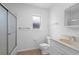 Cozy white bathroom with enclosed shower and tiled floors at 1054 Abeline Dr, Deltona, FL 32725