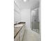 Bathroom featuring a marble counter, a framed mirror and a shower at 1054 Abeline Dr, Deltona, FL 32725