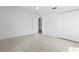 This bedroom features tile flooring, closet and neutral paint at 1054 Abeline Dr, Deltona, FL 32725