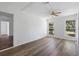 This bedroom features wood flooring, and windows overlooking the yard at 1054 Abeline Dr, Deltona, FL 32725