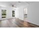 This bedroom features wood flooring, a closet, and a window overlooking the yard at 1054 Abeline Dr, Deltona, FL 32725