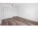 Bright, empty bedroom with wood-look floors and closet at 1054 Abeline Dr, Deltona, FL 32725