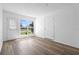 Bright, empty bedroom with wood-look floors and natural light at 1054 Abeline Dr, Deltona, FL 32725