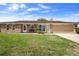 Charming single-story brick home featuring a well-maintained lawn and attached two-car garage at 1054 Abeline Dr, Deltona, FL 32725