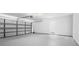 View of a spacious two car garage with painted walls at 1054 Abeline Dr, Deltona, FL 32725