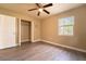 Bedroom featuring closet, ceiling fan, and one window at 1160 Fountainhead Dr, Deltona, FL 32725