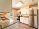 Modern kitchen with granite countertops, stainless steel appliances, and white cabinets at 1160 Fountainhead Dr, Deltona, FL 32725