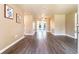 Bright living room with wood floors and glass doors that lead to a lush outdoor space at 1160 Fountainhead Dr, Deltona, FL 32725