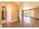 Open concept living room with stainless steel appliances and hardwood flooring at 1160 Fountainhead Dr, Deltona, FL 32725