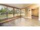 Cozy sunroom with wood flooring, many windows with natural light, and a neutral wall color at 1160 Fountainhead Dr, Deltona, FL 32725