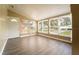 Cozy sunroom with wood flooring, many windows with natural light, and a neutral wall color at 1160 Fountainhead Dr, Deltona, FL 32725