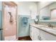 Bathroom featuring a shower, granite countertop vanity, and mirror at 1206 Parkside Dr, Ormond Beach, FL 32174