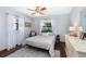 Bright bedroom with plush rug, neutral bedding, and soft natural light at 1206 Parkside Dr, Ormond Beach, FL 32174