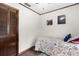 A charming bedroom with wood floors, closet, and floral bedding for a warm, inviting space at 1206 Parkside Dr, Ormond Beach, FL 32174