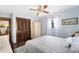 Cozy bedroom featuring hardwood floors, a plush rug, and bright natural light at 1206 Parkside Dr, Ormond Beach, FL 32174
