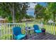 Charming wooden deck with comfortable seating, ideal for enjoying the serene backyard view and sunny days at 1206 Parkside Dr, Ormond Beach, FL 32174