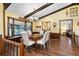 Charming dining room featuring wood floors, beam ceilings, and a window seat nook with natural light at 1206 Parkside Dr, Ormond Beach, FL 32174