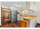 Bright kitchen features wood countertops, stainless steel refrigerator, white appliances, and ample cabinet space at 1206 Parkside Dr, Ormond Beach, FL 32174