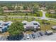 Overhead view of the property highlighting the lush surroundings, mature trees, and convenient parking at 124 Golden Eye Dr # A, Daytona Beach, FL 32119